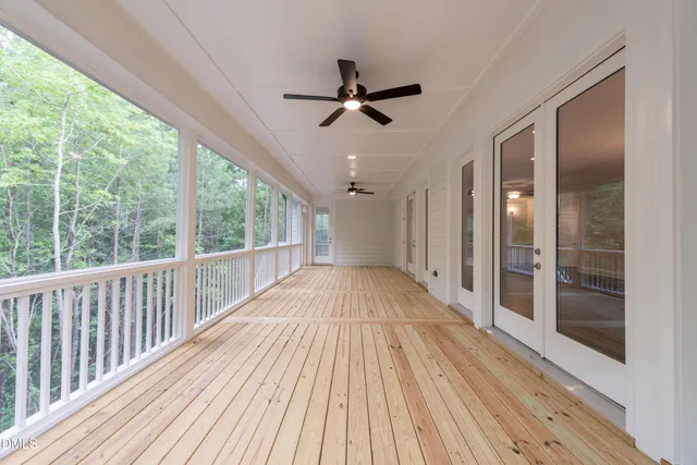 a bathroom with a sink toilet vanity and tub