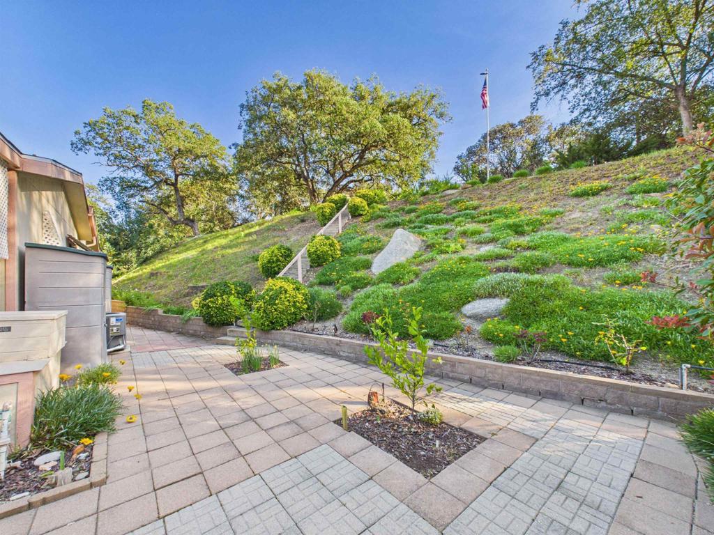 18218 Paradise Mountain Road, Unit 220 Valley Center, CA 92082 - Photo 7 of 48 a view of a garden with pathway