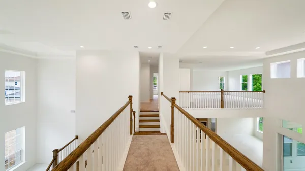 a view of a big room with closet and windows