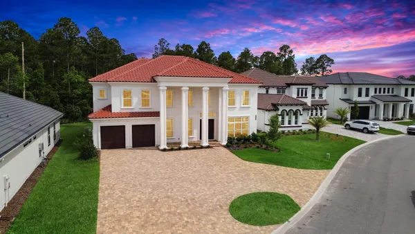 a kitchen with stainless steel appliances a sink stove and cabinets