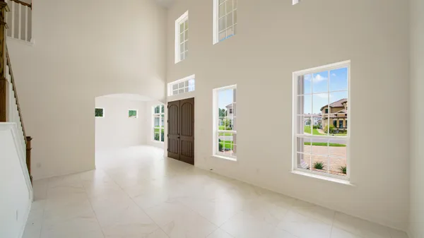 a view of an empty room with a window
