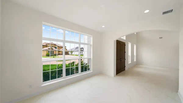 a spacious bathroom with a double vanity sink mirror and double