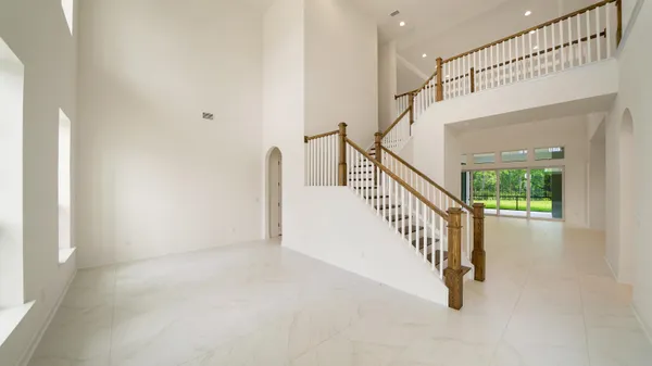 a view of kitchen with furniture and a refrigerator