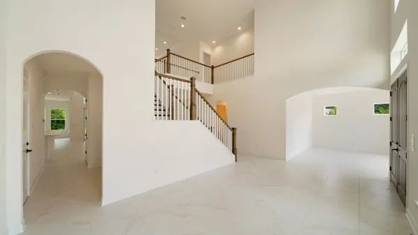 a view of living room with furniture and floor to ceiling window