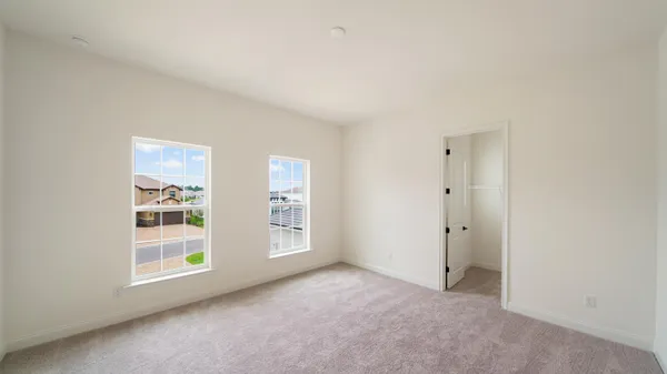 an aerial view of residential houses with outdoor space and swimming pool