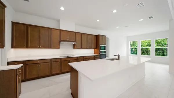 a bathroom with a shower and a glass door