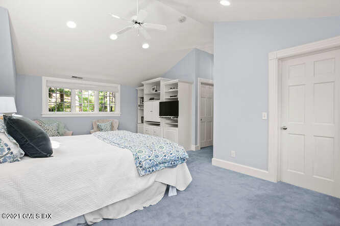 23 Parsonage Road Greenwich, CT 06830 - Photo 24 of 41 a bedroom with a large bed and a window