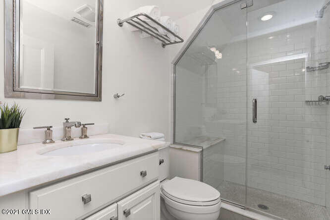 23 Parsonage Road Greenwich, CT 06830 - Photo 27 of 41 a bathroom with a sink a toilet and shower