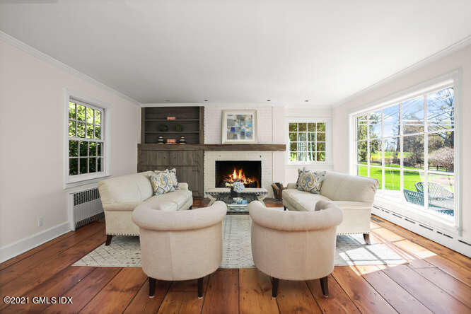 23 Parsonage Road Greenwich, CT 06830 - Photo 5 of 41 a living room with furniture and a fireplace