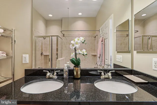a bathroom with sinks and a mirror