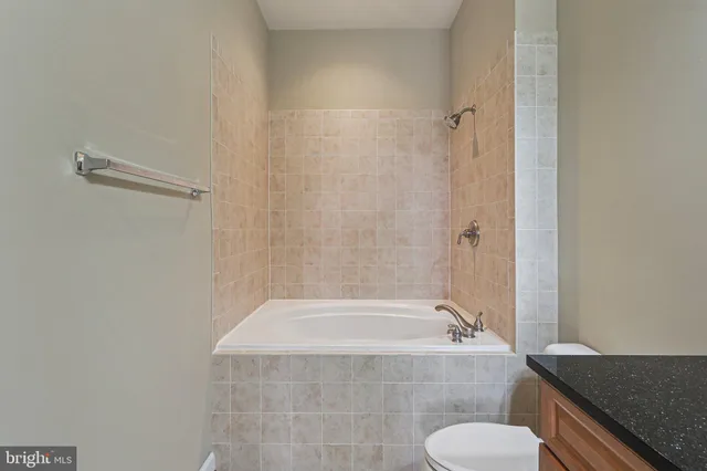 a bath tub sitting next to a toilet