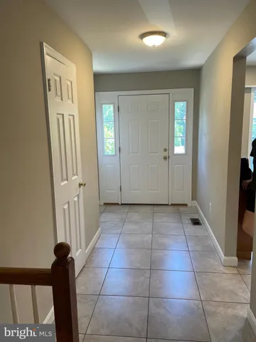 a view of a hallway with front door