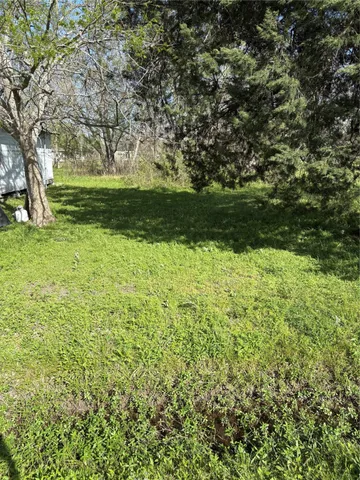 a view of backyard with green space