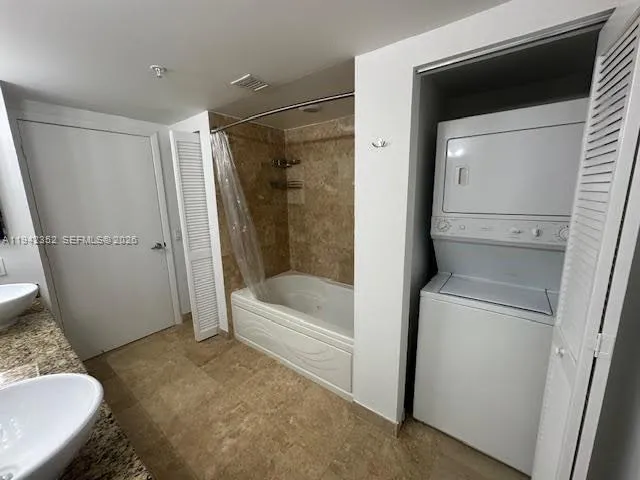 a bathroom with a tub and a sink