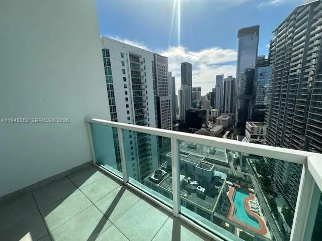 a view of balcony with wooden floor and fence