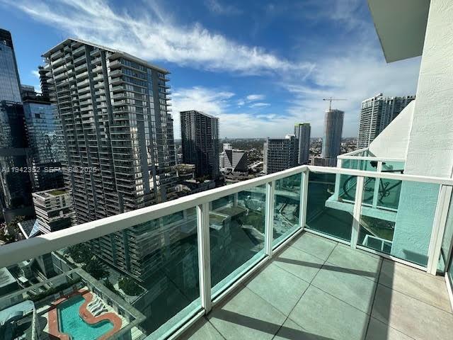 41 Southeast 5th Street, Unit 2112 Miami, FL 33131 - Photo 23 of 45 a view of balcony with wooden floor and fence
