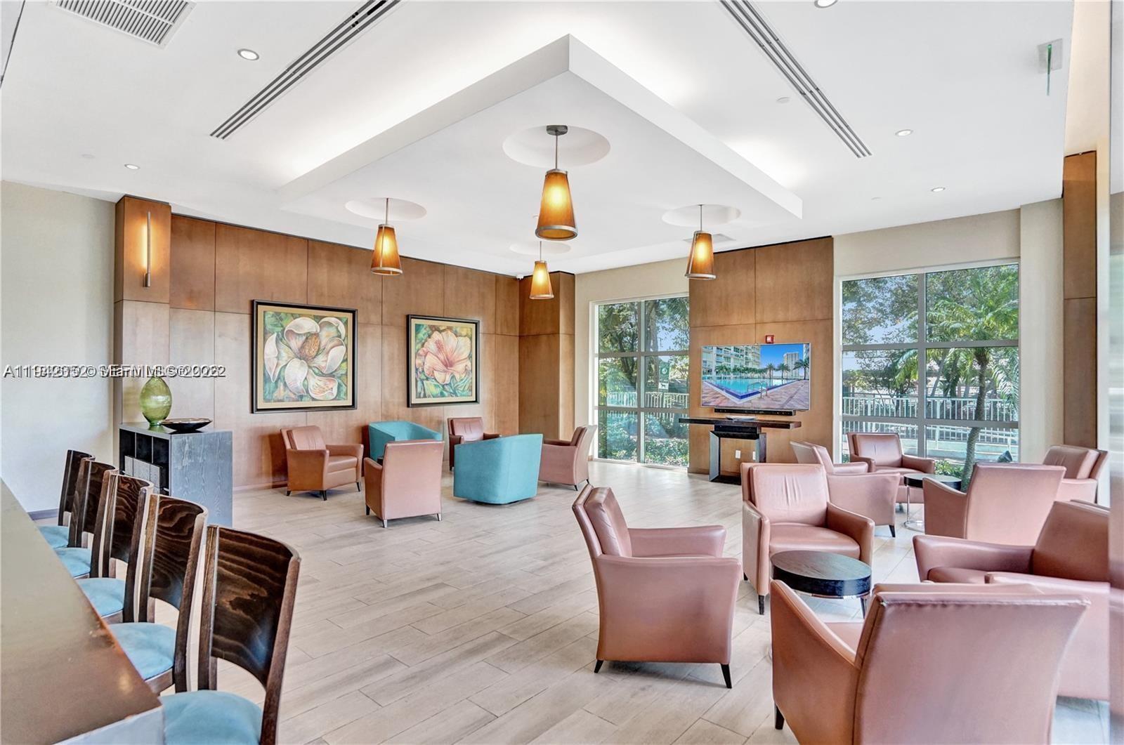 41 Southeast 5th Street, Unit 2112 Miami, FL 33131 - Photo 37 of 45 a living room with fireplace furniture and a large window