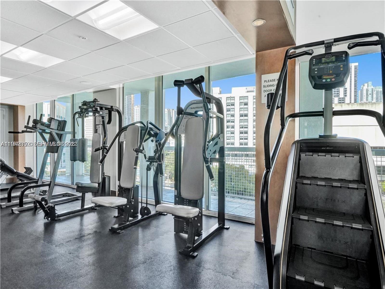 41 Southeast 5th Street, Unit 2112 Miami, FL 33131 - Photo 38 of 45 a view of a room with gym equipment