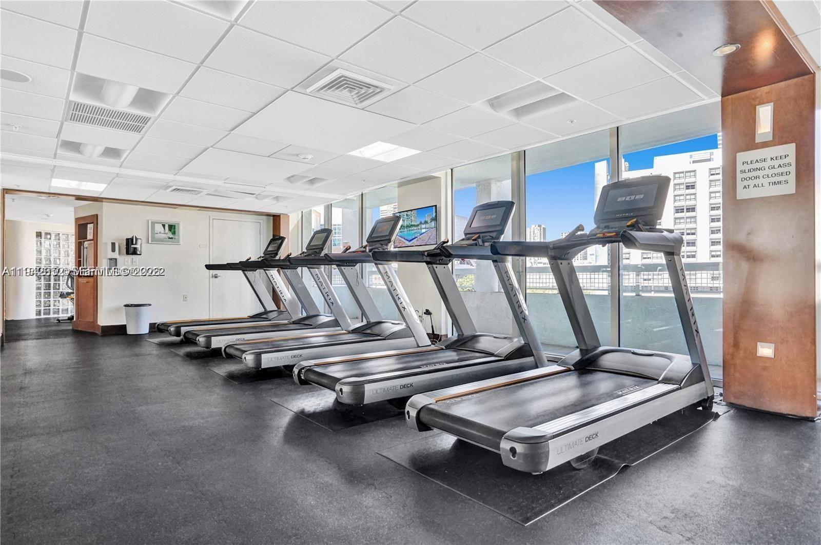 41 Southeast 5th Street, Unit 2112 Miami, FL 33131 - Photo 40 of 45 a view of a room with gym equipment