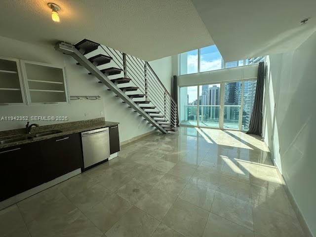 41 Southeast 5th Street, Unit 2112 Miami, FL 33131 - Photo 6 of 45 a view of a livingroom with wooden floor and stairs