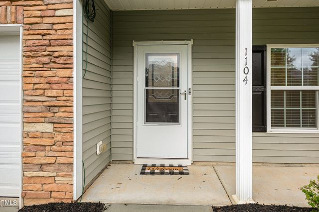 a view of a door and a window