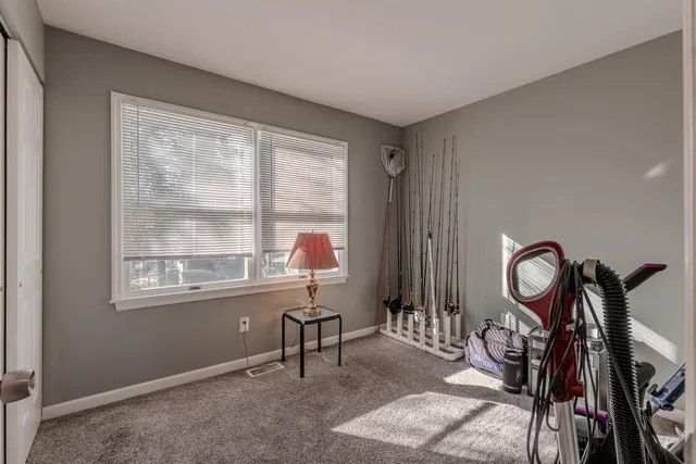 a view of a livingroom with furniture and windows