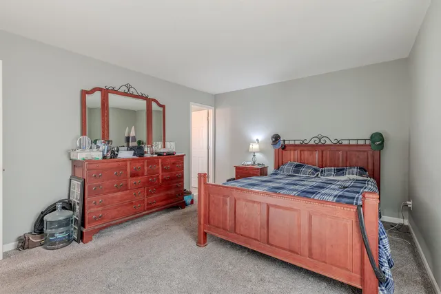 a view of a balcony with wooden floor and fence