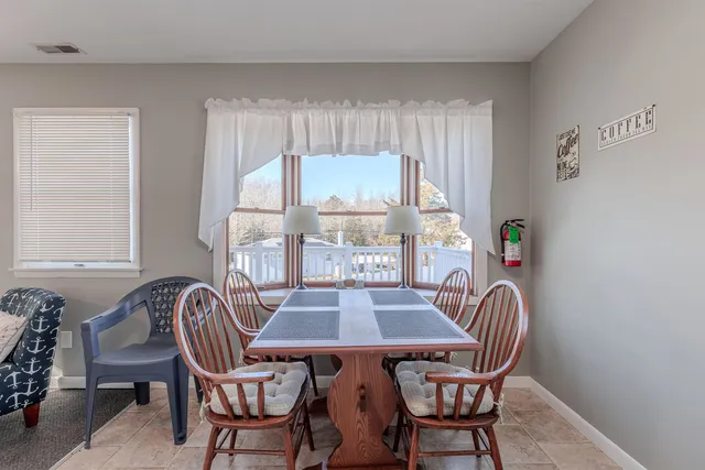 a view of a livingroom with furniture window and outdoor view