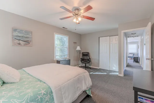 a bathroom with a sink toilet and mirror