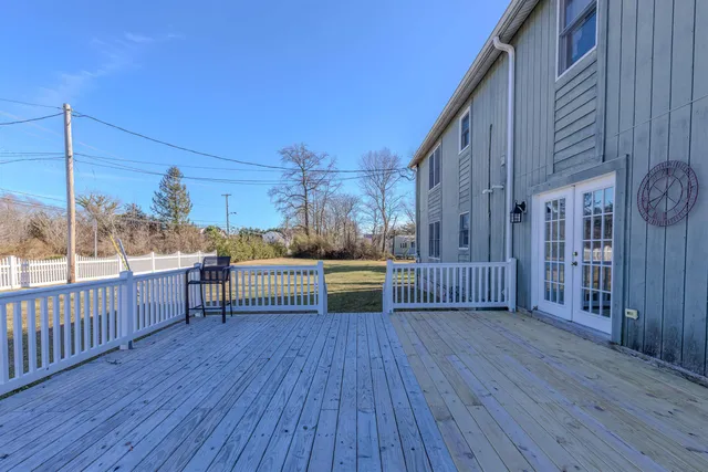 a view of a porch with wooden floor