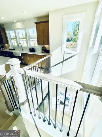 a view of an entryway with wooden floor
