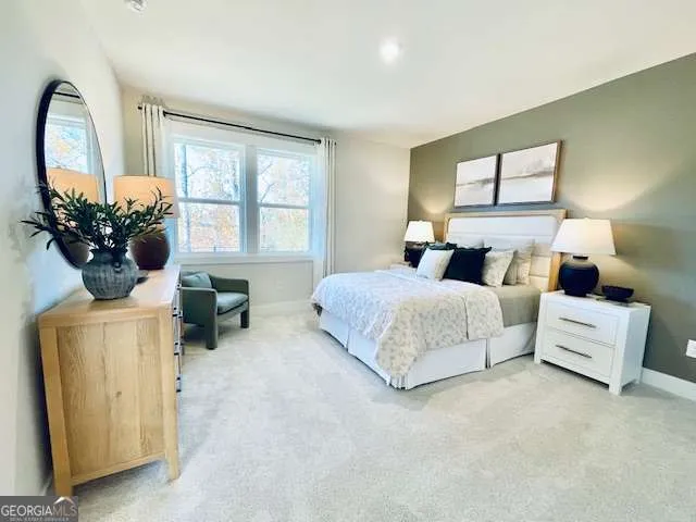 a bedroom with bed and a window