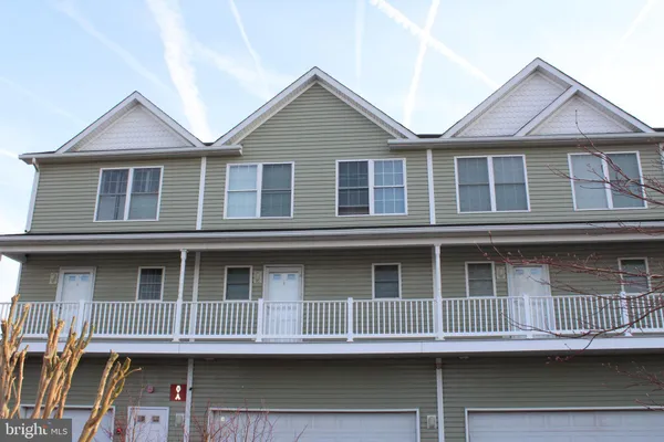a view of a big house with many windows
