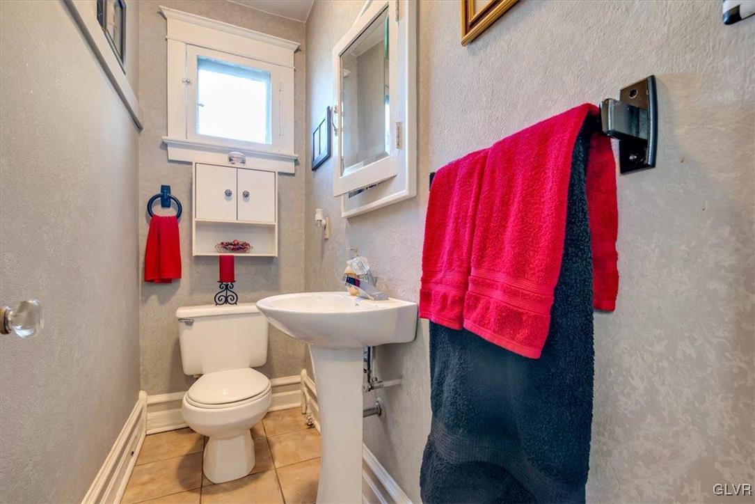 2107 Walbert Avenue Allentown, PA 18104 - Photo 22 of 55 a bathroom with a sink toilet and mirror