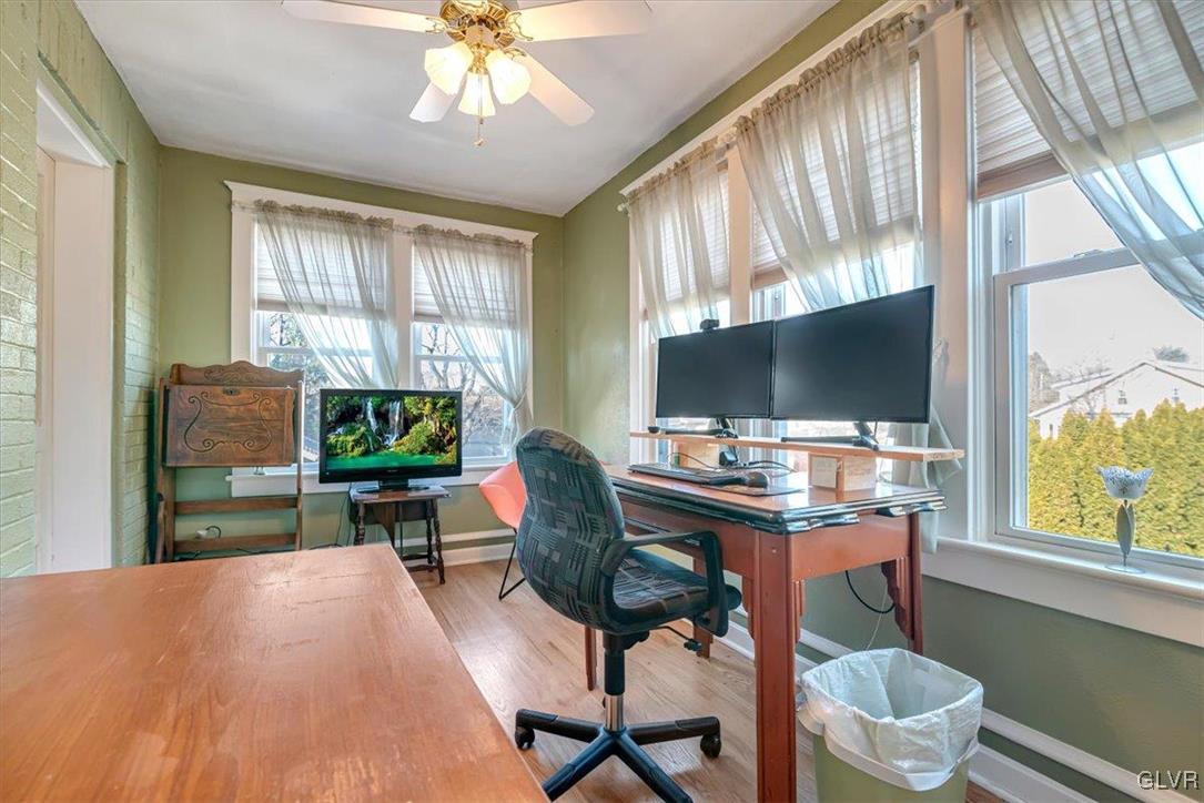 2107 Walbert Avenue Allentown, PA 18104 - Photo 29 of 55 a living room with furniture a flat screen tv and a large window