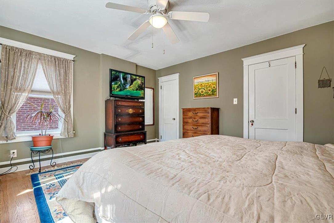 2107 Walbert Avenue Allentown, PA 18104 - Photo 34 of 55 a bedroom with a bed and a chandelier