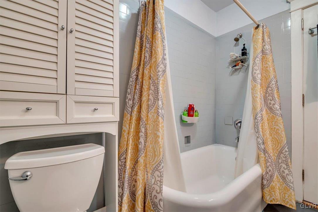 2107 Walbert Avenue Allentown, PA 18104 - Photo 36 of 55 a bathroom with a bathtub and a shower
