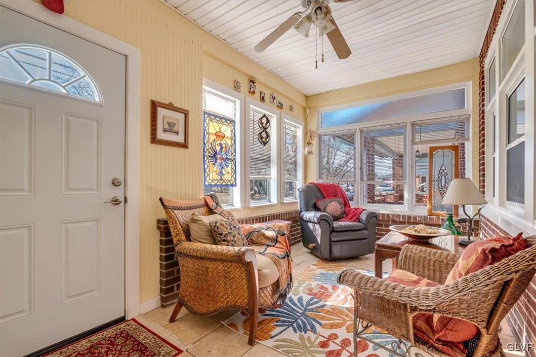 2107 Walbert Avenue Allentown, PA 18104 - Photo 5 of 55 a living room with furniture ceiling fan and a rug