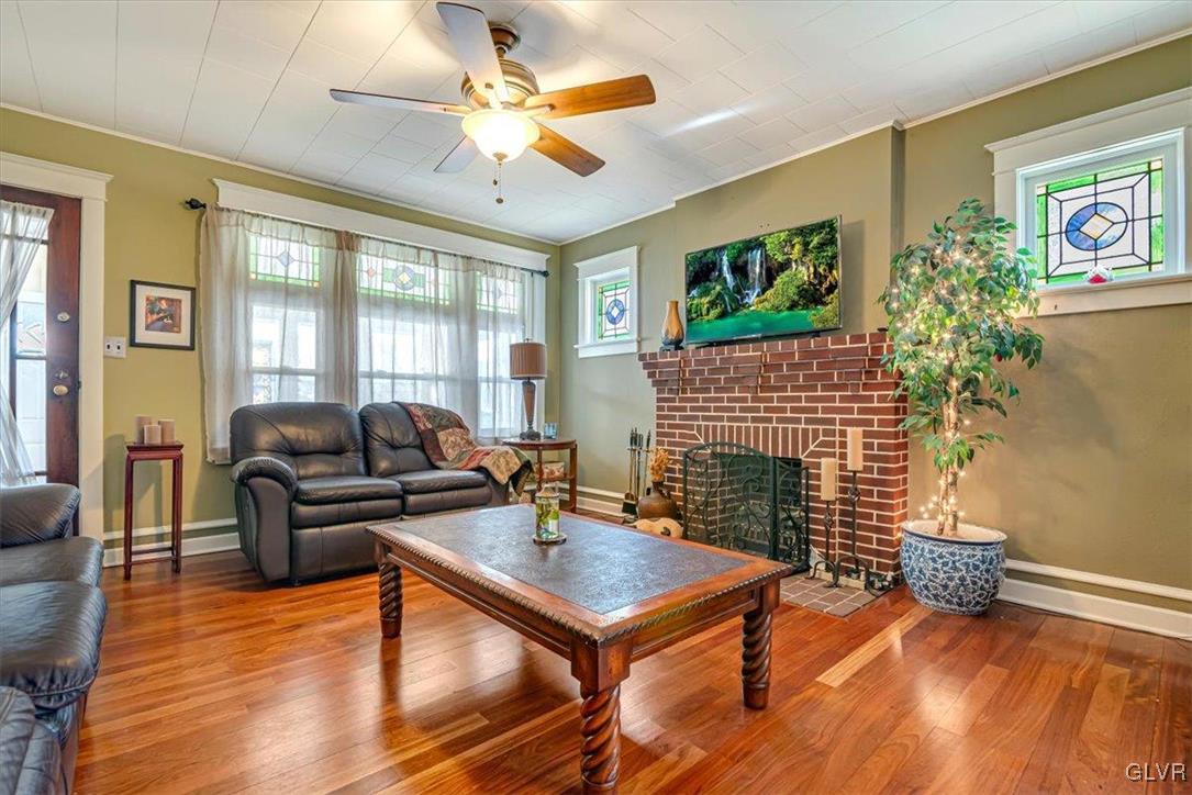 2107 Walbert Avenue Allentown, PA 18104 - Photo 10 of 55 a living room with furniture a fireplace and a flat screen tv
