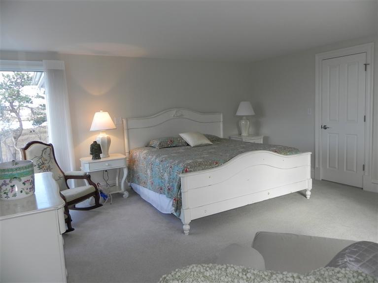 157 Monomoscoy Road Mashpee, MA 02649 - Photo 13 of 28 a bedroom with a bed chair and window