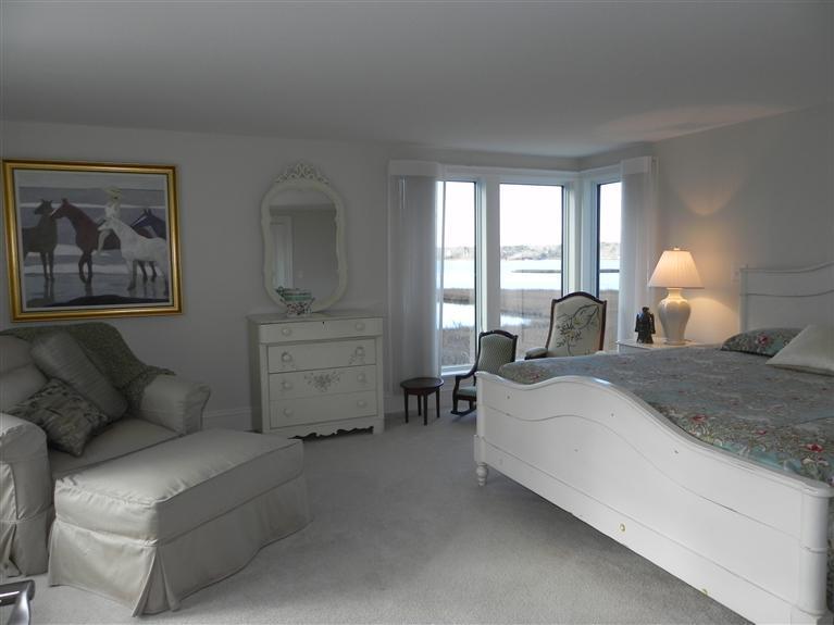 157 Monomoscoy Road Mashpee, MA 02649 - Photo 14 of 28 a bedroom with bed and window