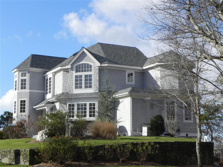 157 Monomoscoy Road Mashpee, MA 02649 - Photo 2 of 28 a front view of a house with a yard