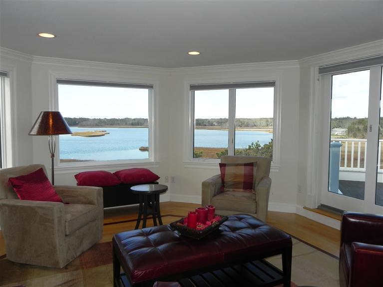 157 Monomoscoy Road Mashpee, MA 02649 - Photo 24 of 28 a living room with furniture and a large window