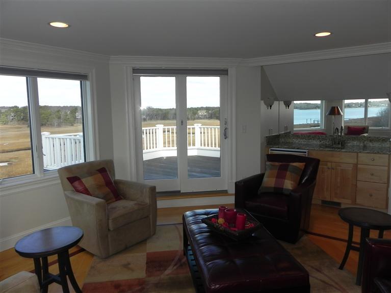 157 Monomoscoy Road Mashpee, MA 02649 - Photo 25 of 28 a living room with furniture and a large window