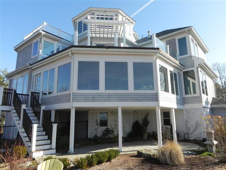 157 Monomoscoy Road Mashpee, MA 02649 - Photo 3 of 28 a front view of a house with a yard