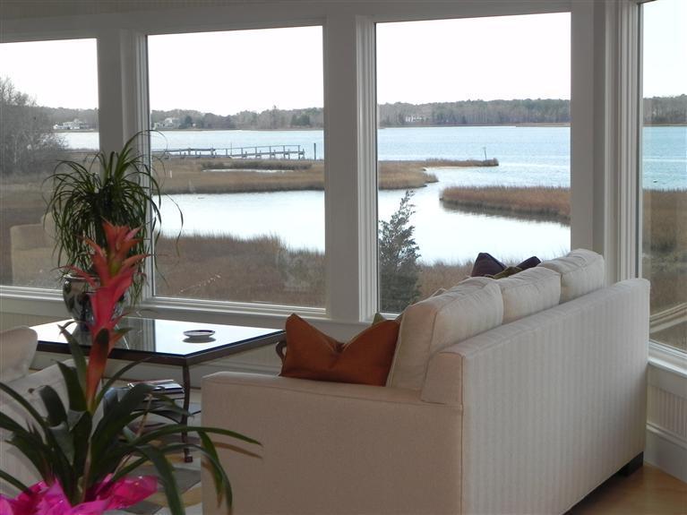 157 Monomoscoy Road Mashpee, MA 02649 - Photo 6 of 28 a living room with furniture and a floor to ceiling window