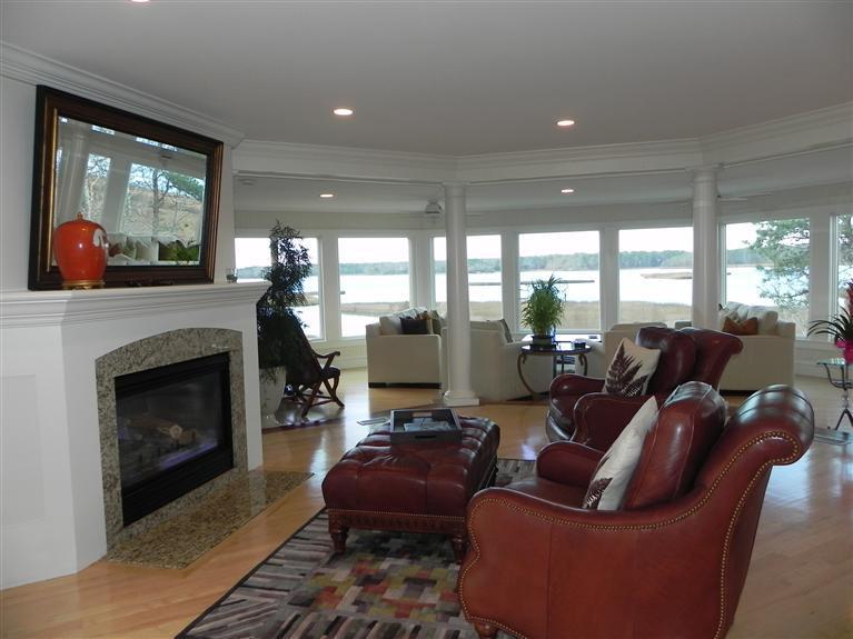 157 Monomoscoy Road Mashpee, MA 02649 - Photo 8 of 28 a living room with furniture and a fireplace