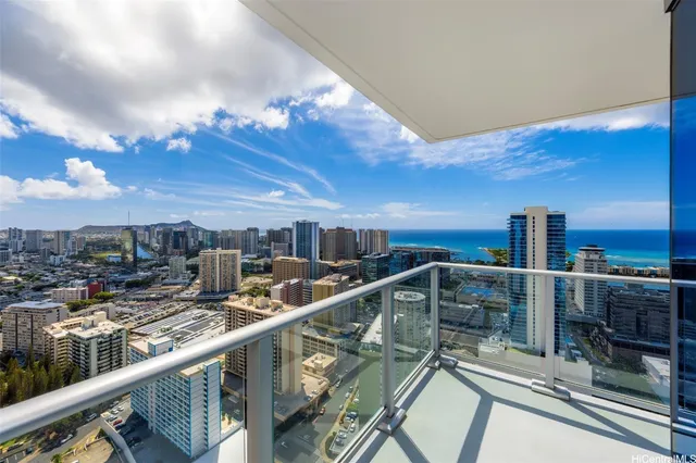 a view of a balcony with two chairs