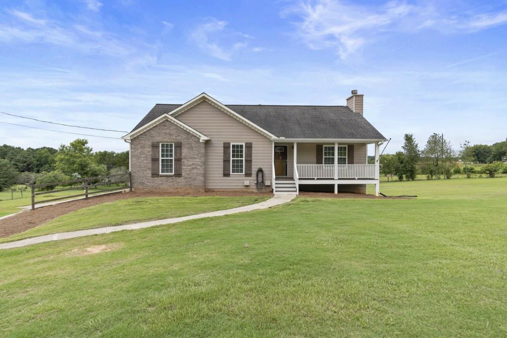 a front view of a house with garden