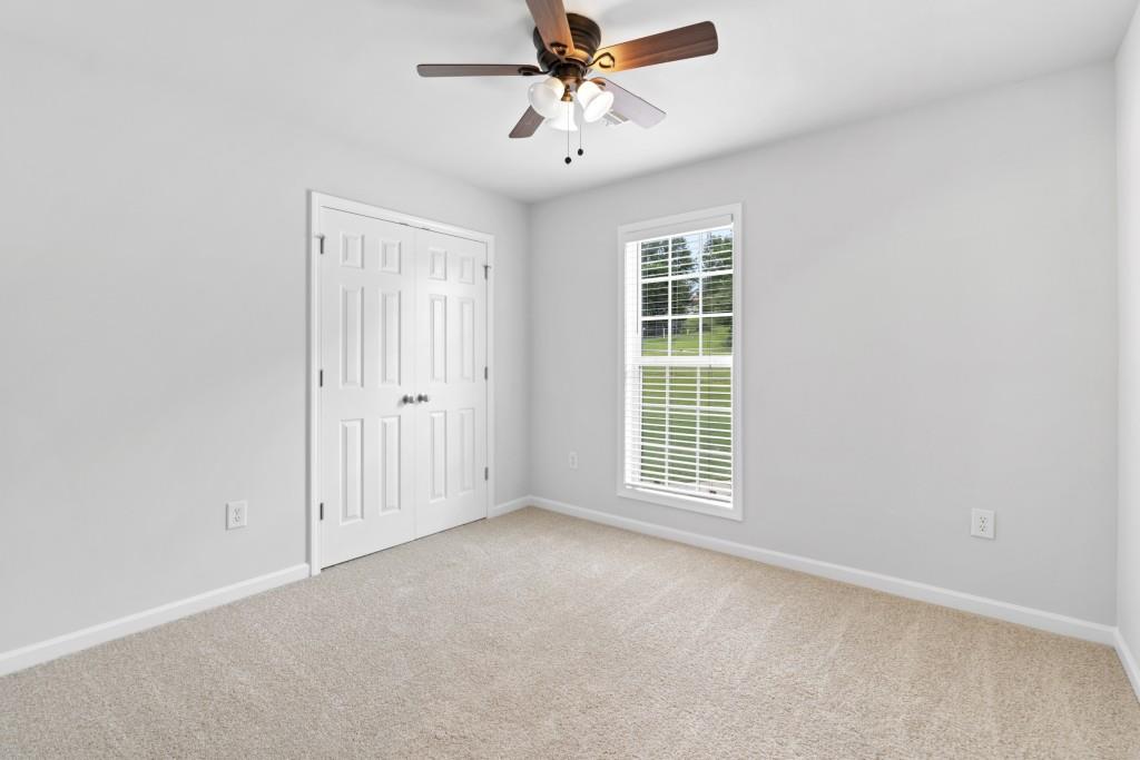 1214 Roxey Maxey Road Southwest Winder, GA 30680 - Photo 15 of 35 a view of an empty room with a window